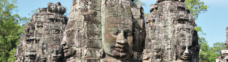 Steinerne Gesichter am Bayon Tempel in Angkor in Kambodscha